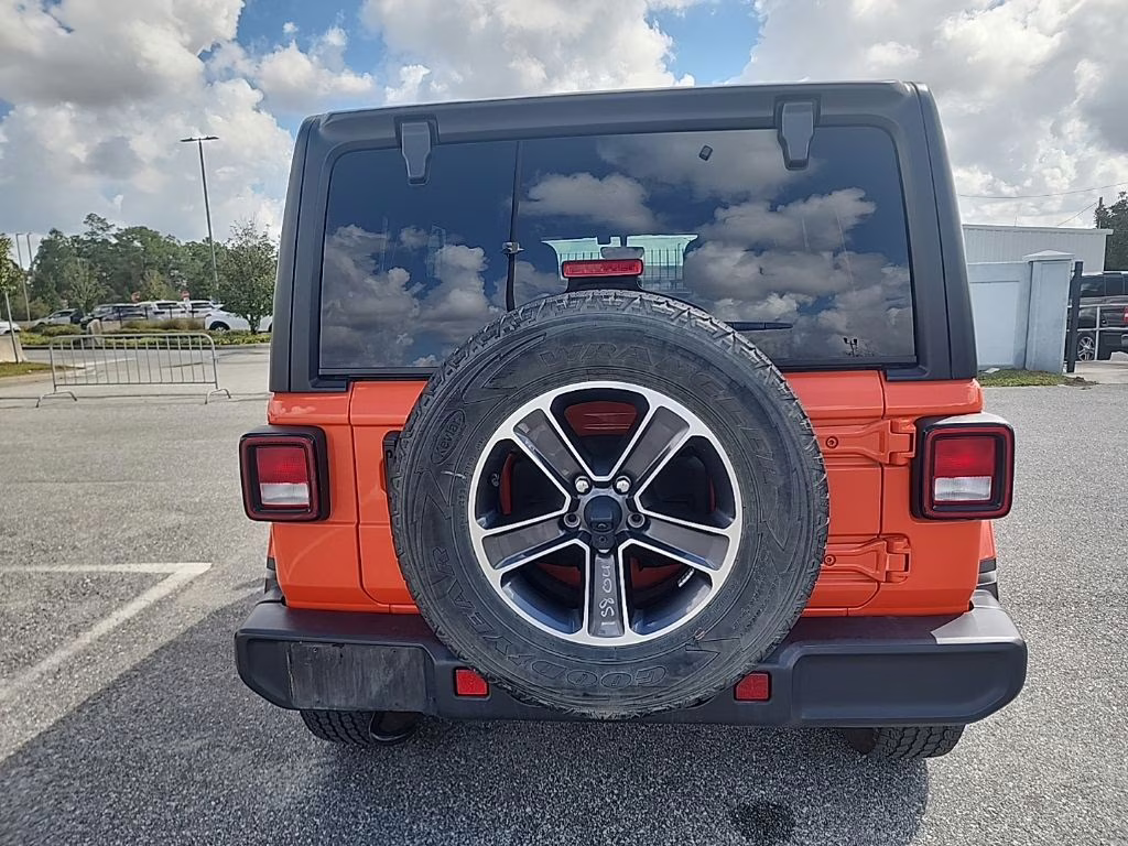 2023 orange Jeep Wrangler Sahara 4X4 SUV