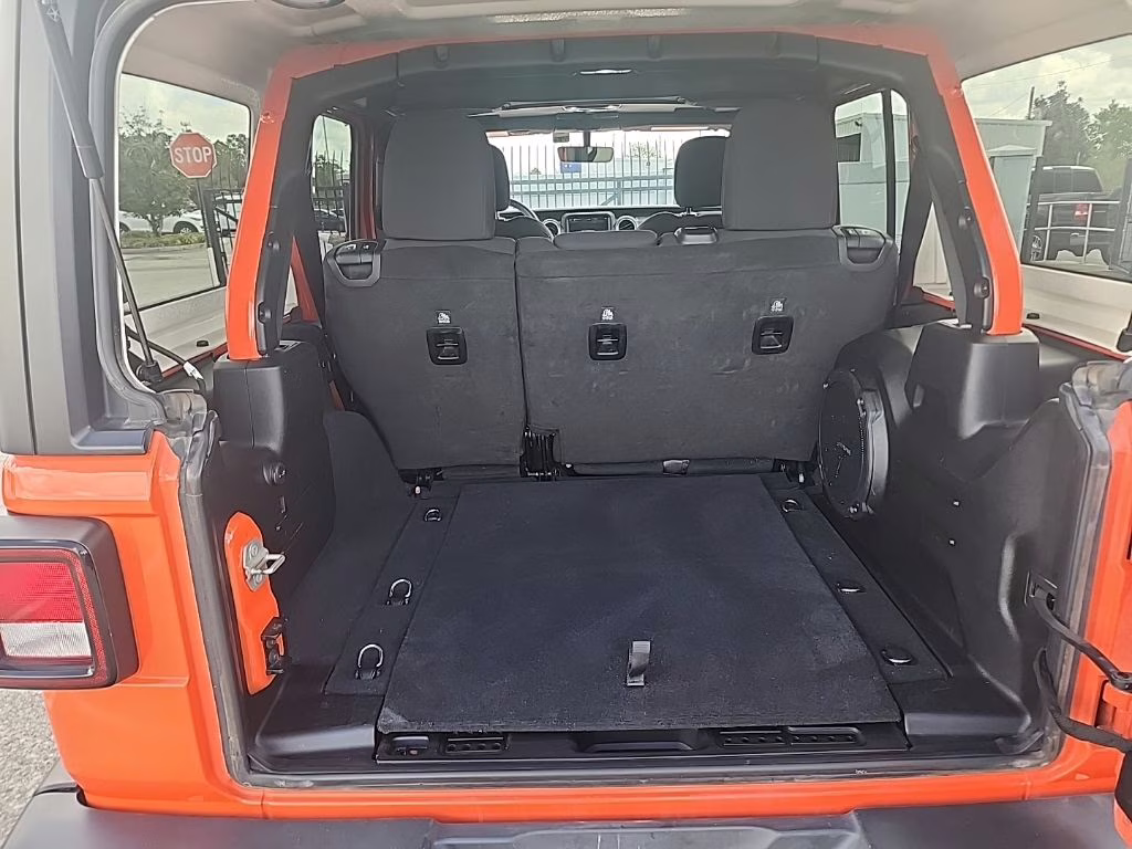 2023 orange Jeep Wrangler Sahara 4X4 SUV