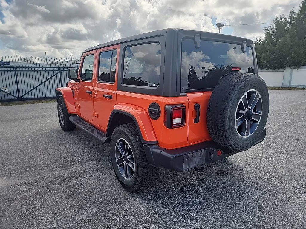 2023 orange Jeep Wrangler Sahara 4X4 SUV