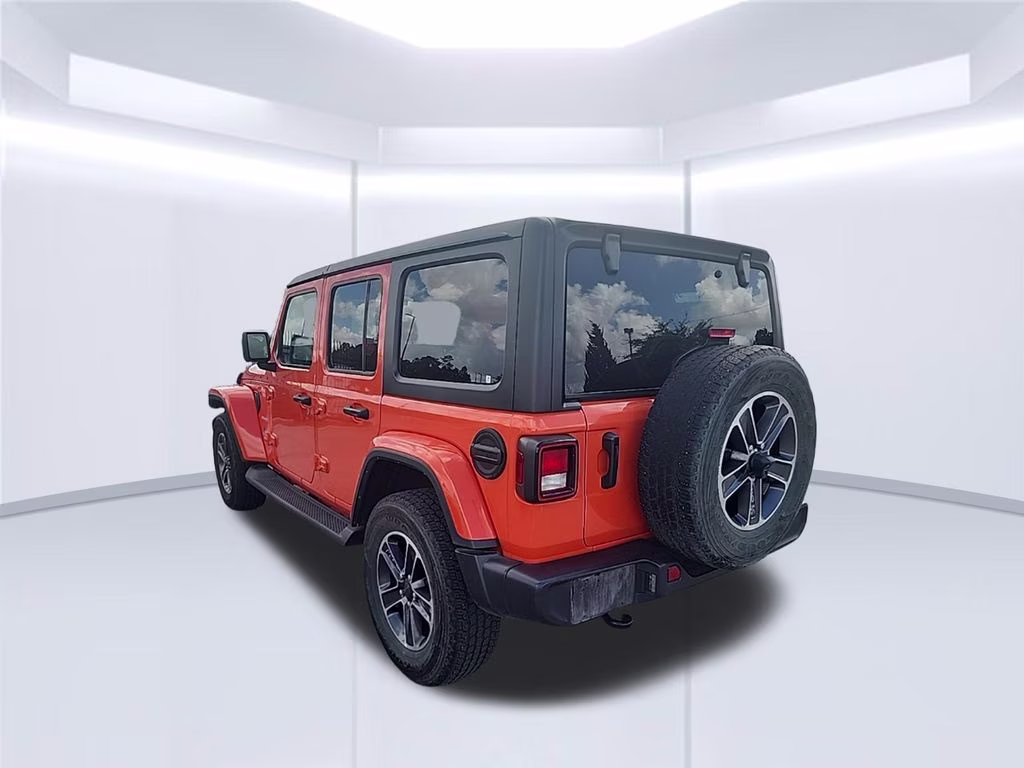 2023 orange Jeep Wrangler Sahara 4X4 SUV