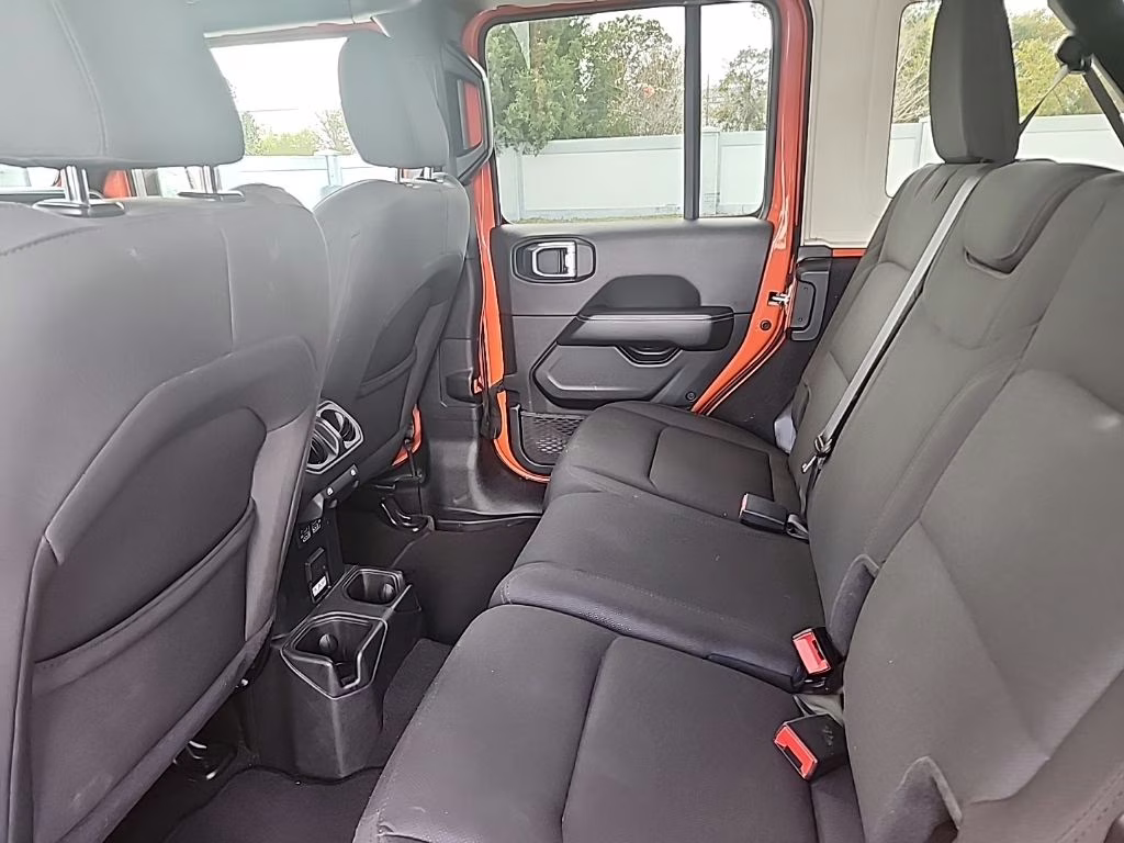 2023 orange Jeep Wrangler Sahara 4X4 SUV