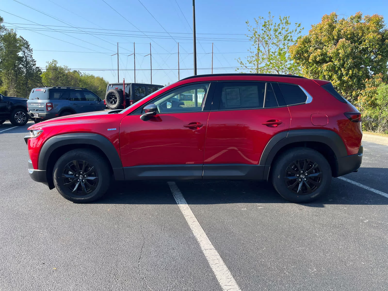 2025 Soul Red Crystal Metallic Mazda CX-50 Hybrid Premium Package AWD SUV
