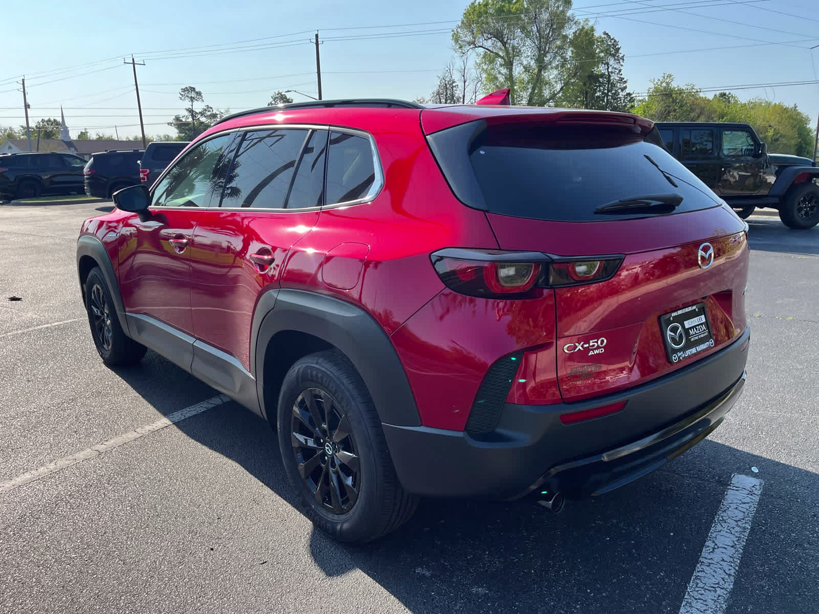 2025 Soul Red Crystal Metallic Mazda CX-50 Hybrid Premium Package AWD SUV