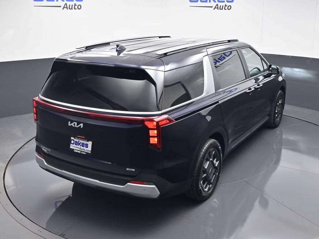 2026 Deep Chroma Blue Kia Carnival Hybrid EX FWD Van