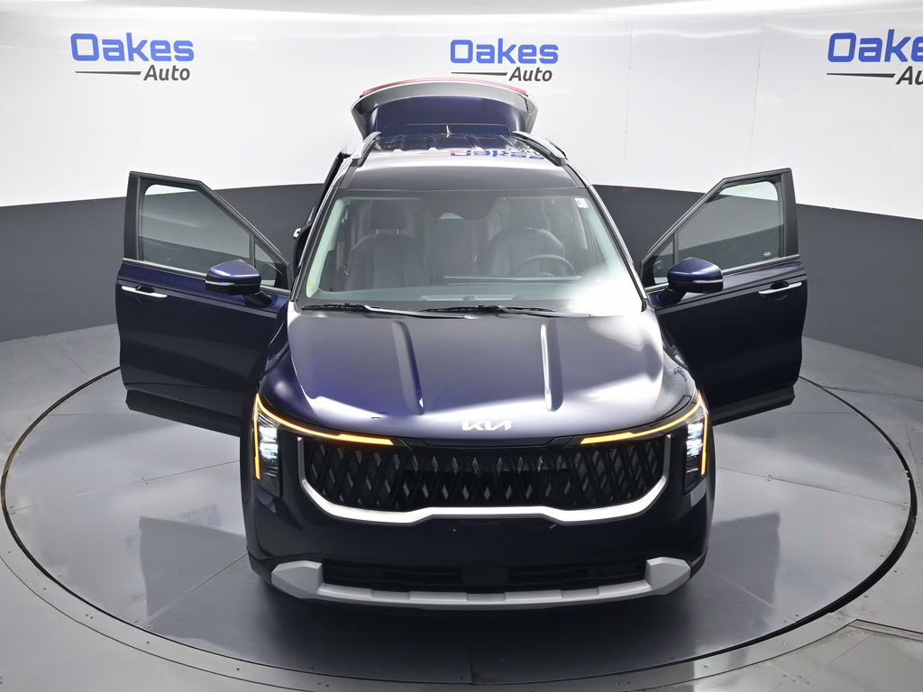 2026 Deep Chroma Blue Kia Carnival Hybrid EX FWD Van