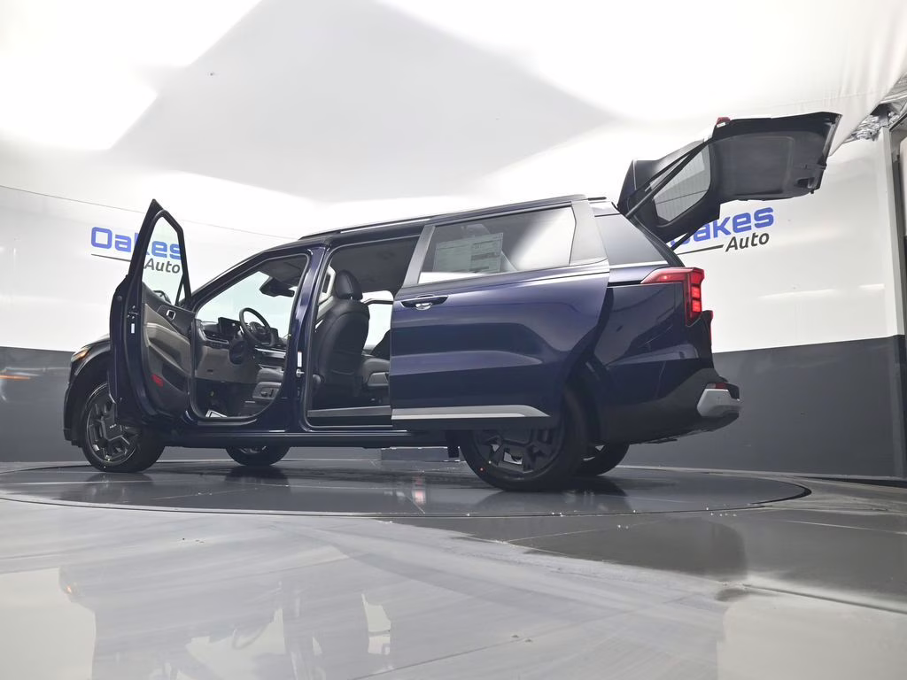 2026 Deep Chroma Blue Kia Carnival Hybrid EX FWD Van