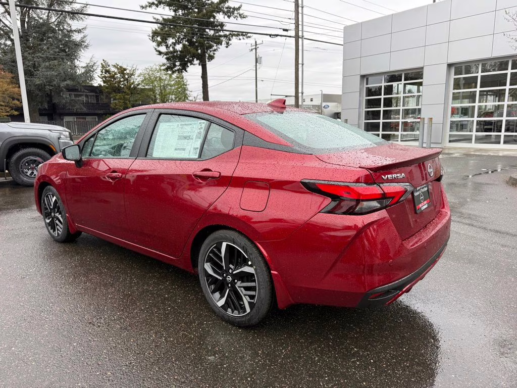 2025 Scarlet Ember Tintcoat Nissan Versa 1.6 SR FWD Sedan