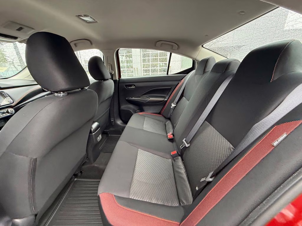 2025 Scarlet Ember Tintcoat Nissan Versa 1.6 SR FWD Sedan