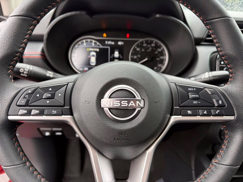 2025 Scarlet Ember Tintcoat Nissan Versa 1.6 SR FWD Sedan