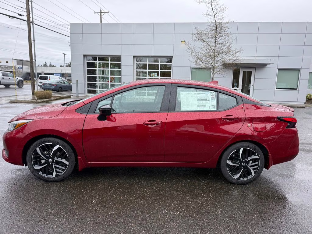 2025 Scarlet Ember Tintcoat Nissan Versa 1.6 SR FWD Sedan