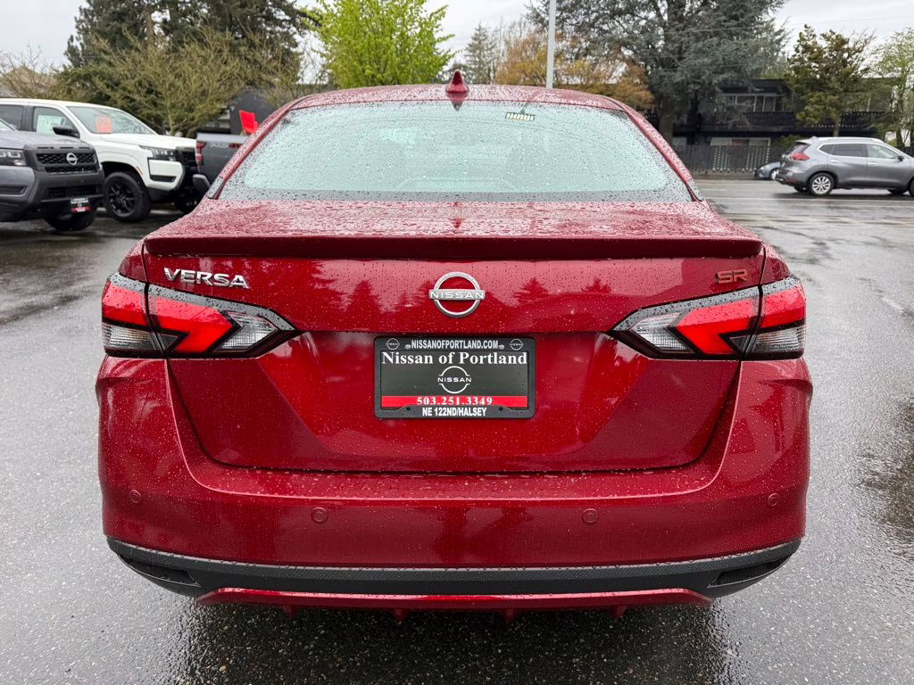 2025 Scarlet Ember Tintcoat Nissan Versa 1.6 SR FWD Sedan