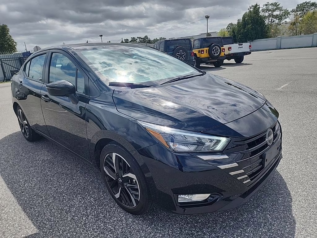 2024 Super Black Nissan Versa 1.6 SR FWD Sedan