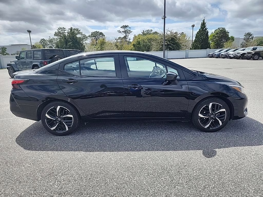 2024 Super Black Nissan Versa 1.6 SR FWD Sedan