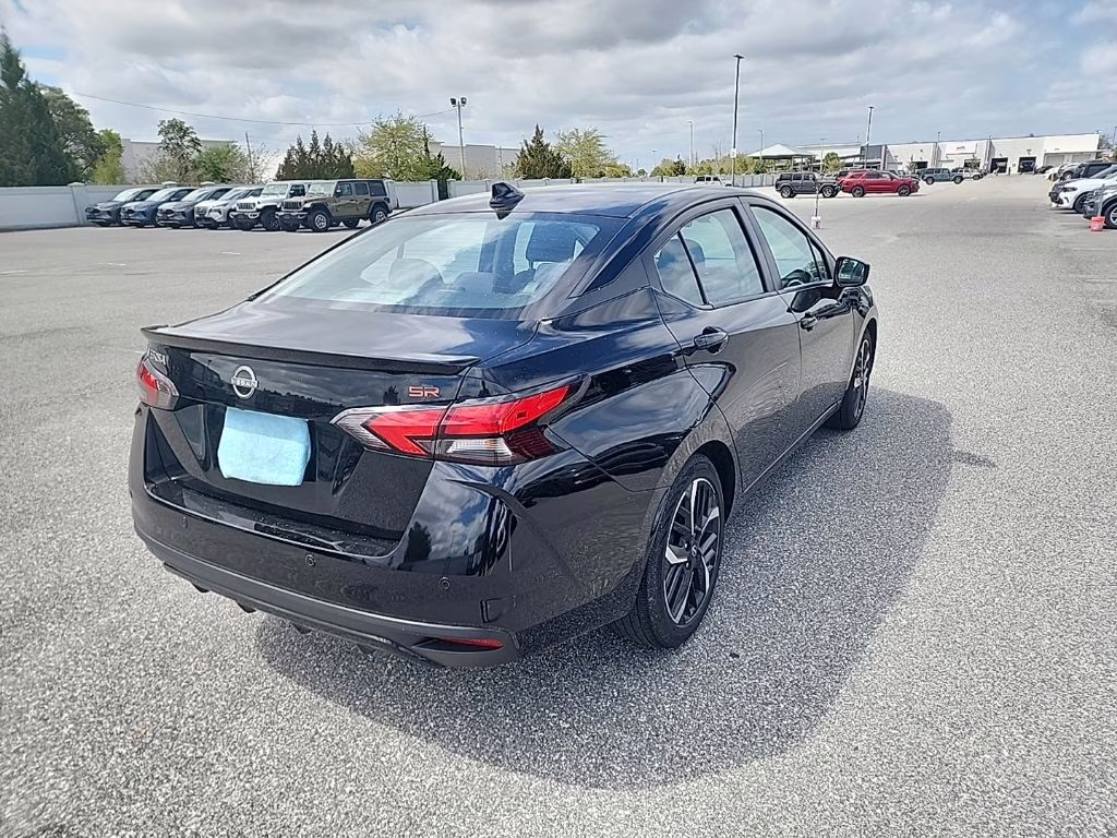 2024 Super Black Nissan Versa 1.6 SR FWD Sedan