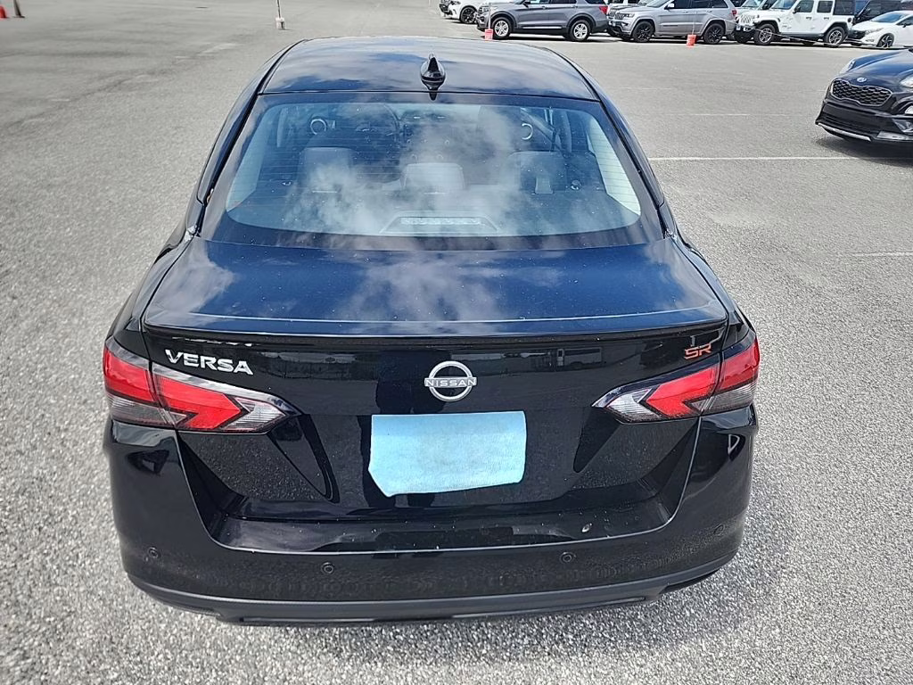2024 Super Black Nissan Versa 1.6 SR FWD Sedan