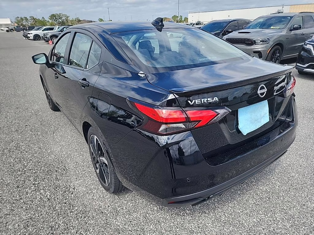 2024 Super Black Nissan Versa 1.6 SR FWD Sedan