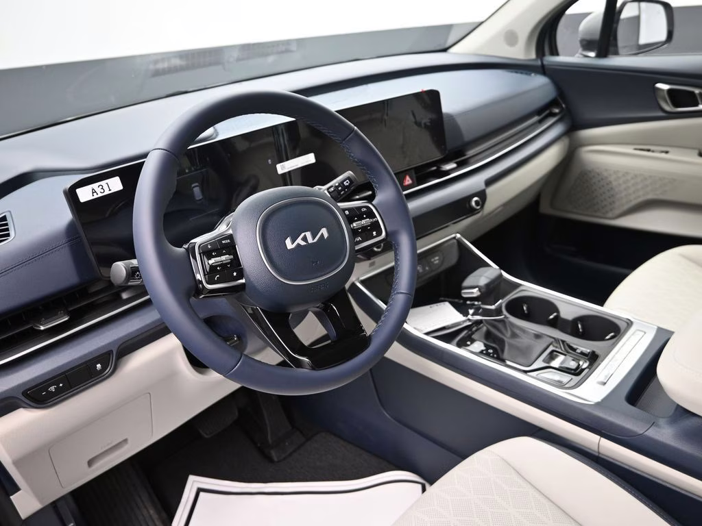 2026 Ceramic Silver Kia Carnival EX FWD Van