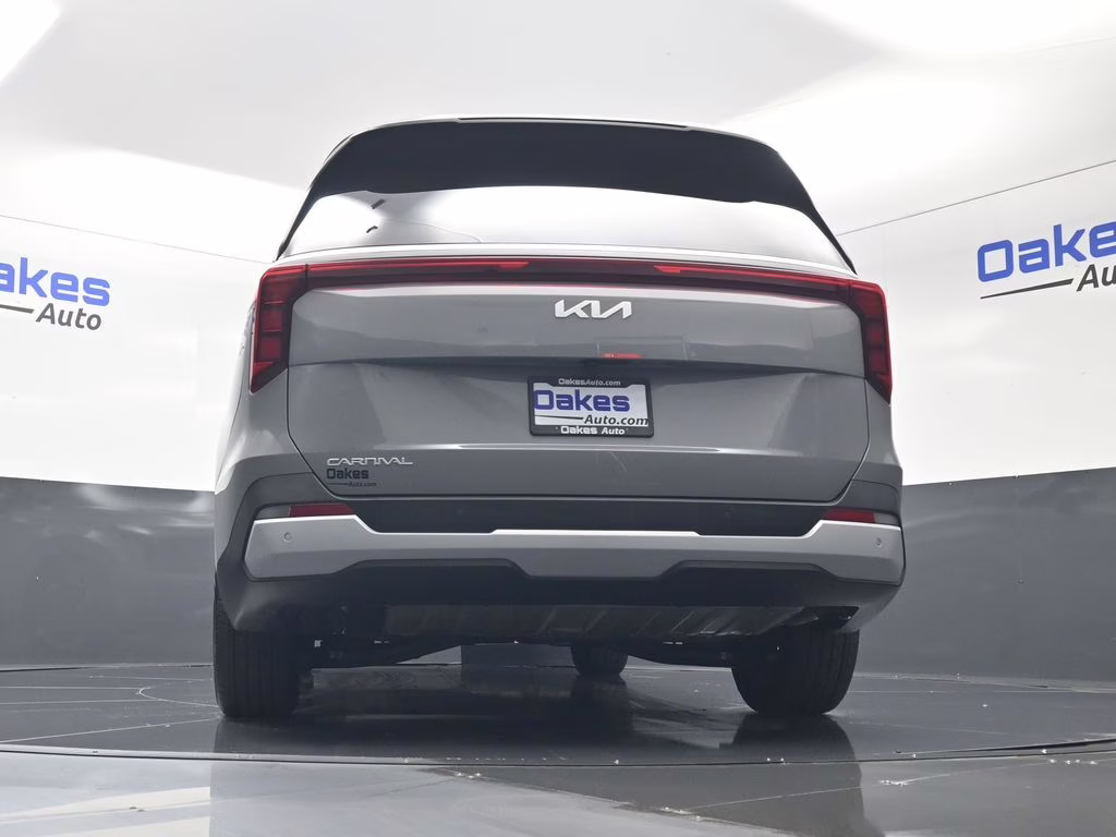2026 Ceramic Silver Kia Carnival EX FWD Van