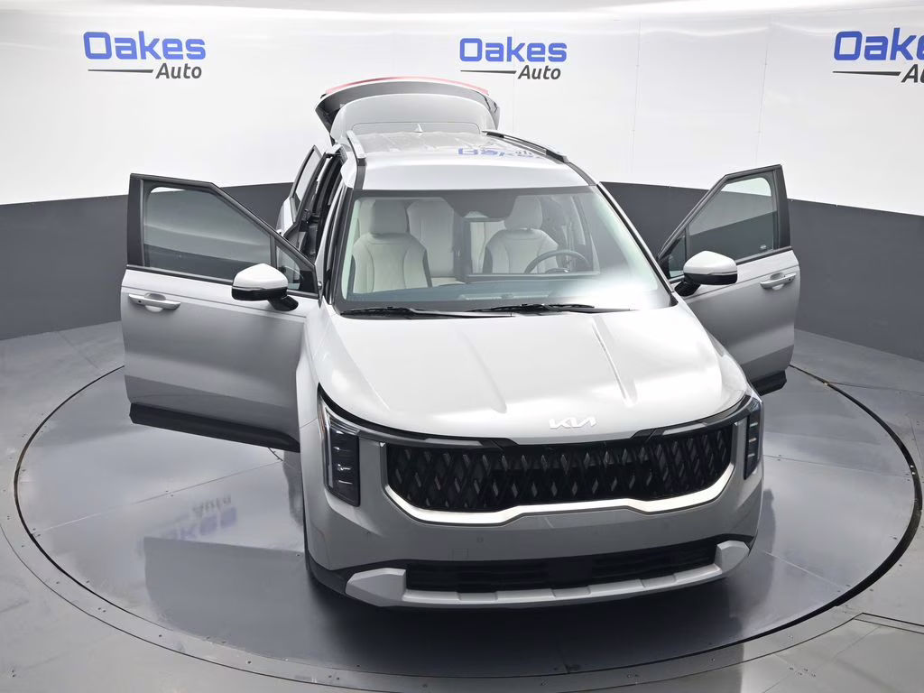 2026 Ceramic Silver Kia Carnival EX FWD Van