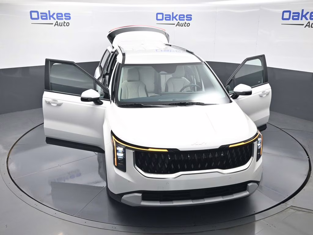 2026 Snow White Pearl Kia Carnival Hybrid EX FWD Van