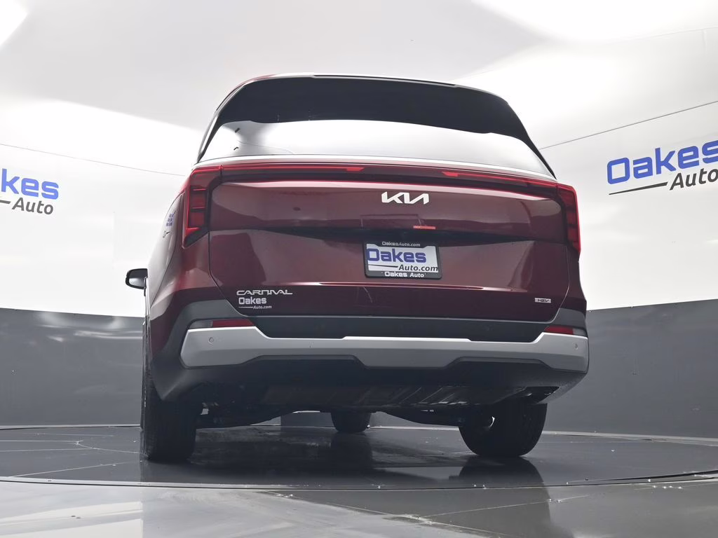 2026 Flare Red Kia Carnival Hybrid EX FWD Van