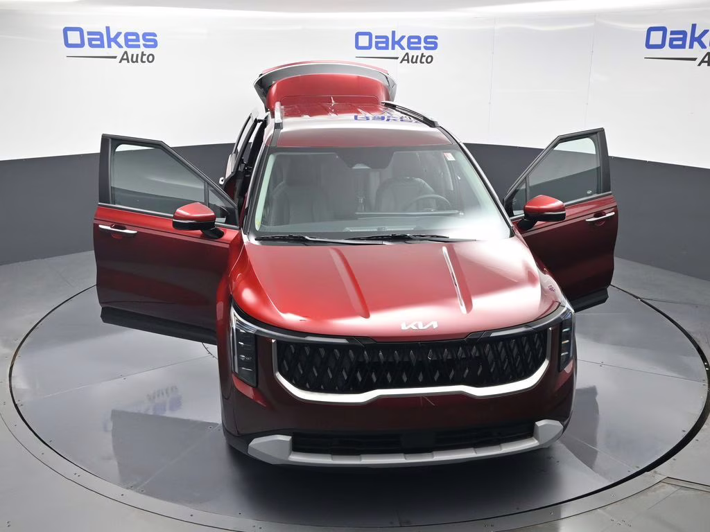 2026 Flare Red Kia Carnival Hybrid EX FWD Van