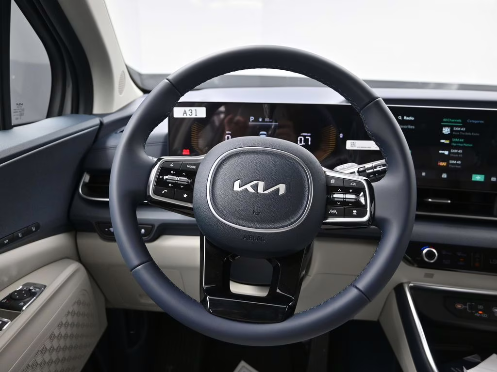 2026 Ceramic Silver Kia Carnival EX FWD Van