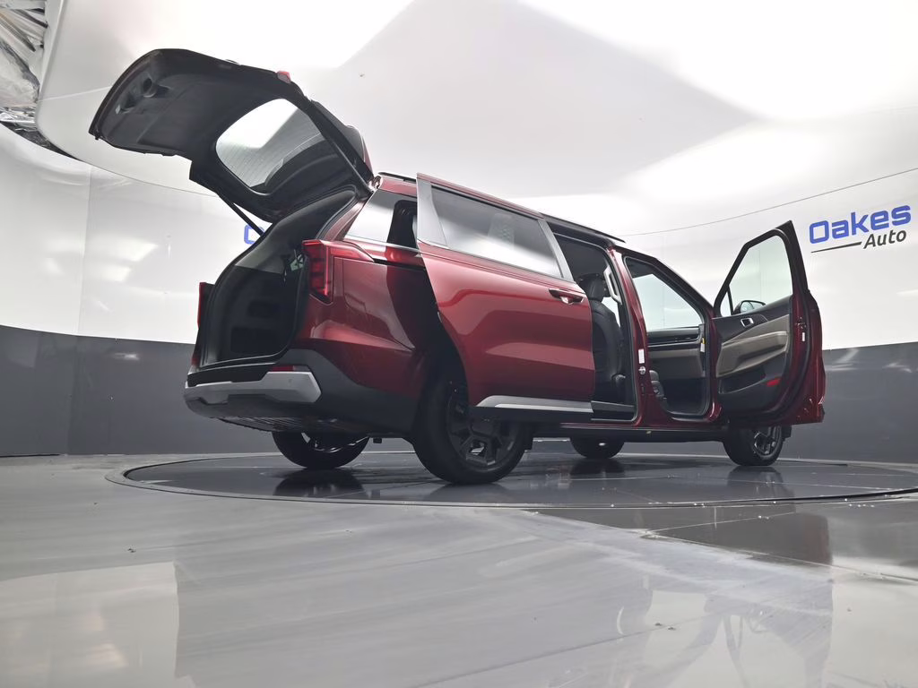 2026 Flare Red Kia Carnival Hybrid EX FWD Van