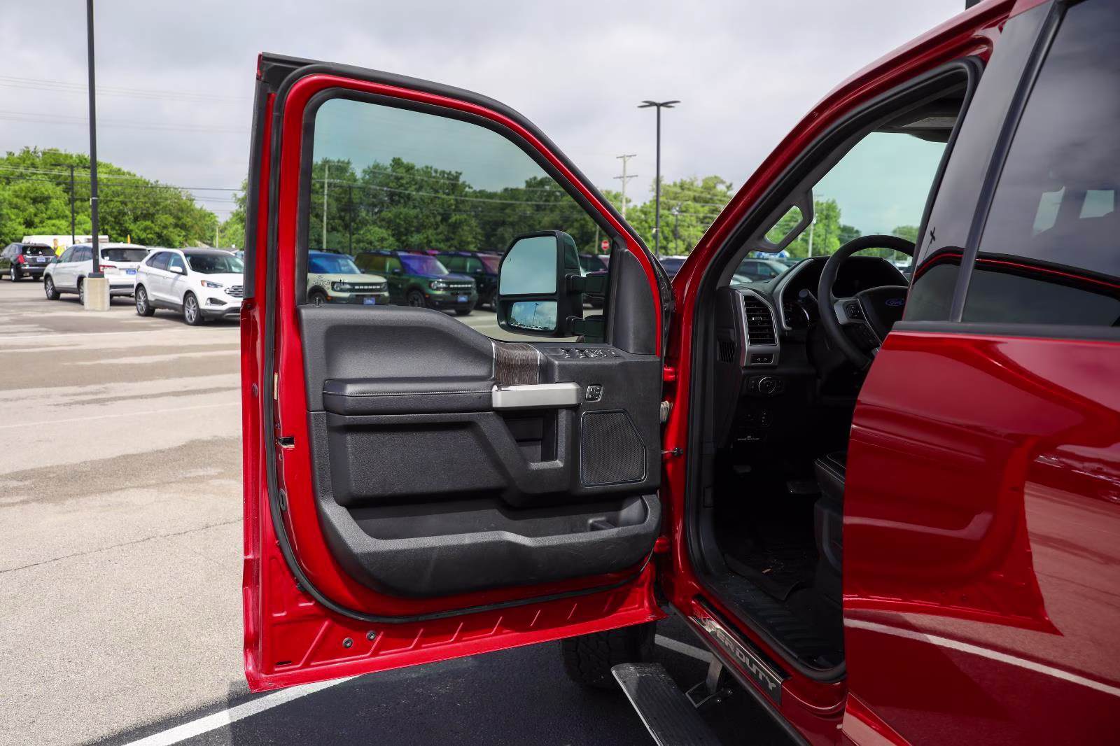2021 Rapid Red Metallic Tinted Clearcoat Ford Super Duty F-250 SRW Lariat 4X4 Truck