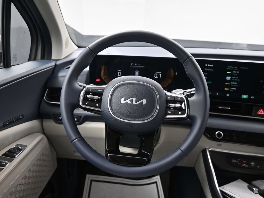 2026 Ceramic Silver Kia Carnival EX FWD Van