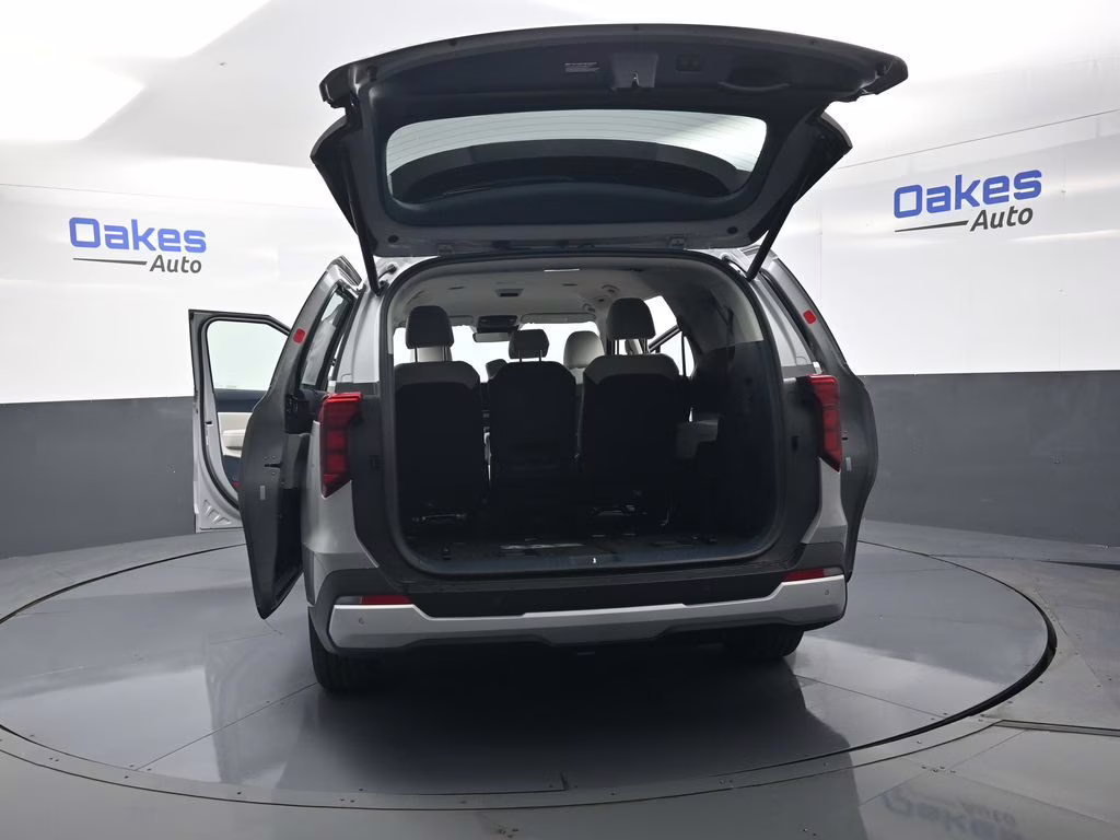 2026 Ceramic Silver Kia Carnival EX FWD Van