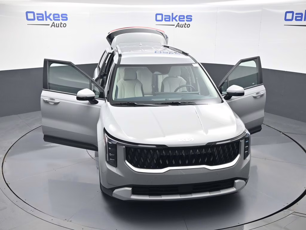 2026 Ceramic Silver Kia Carnival EX FWD Van