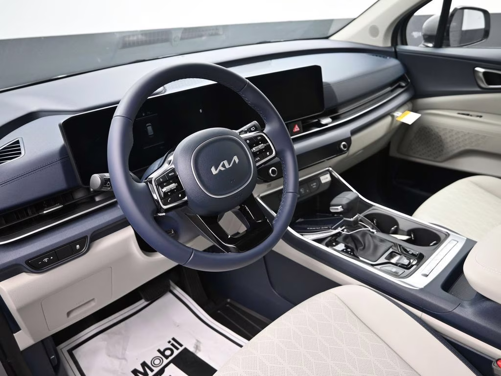 2026 Ceramic Silver Kia Carnival EX FWD Van