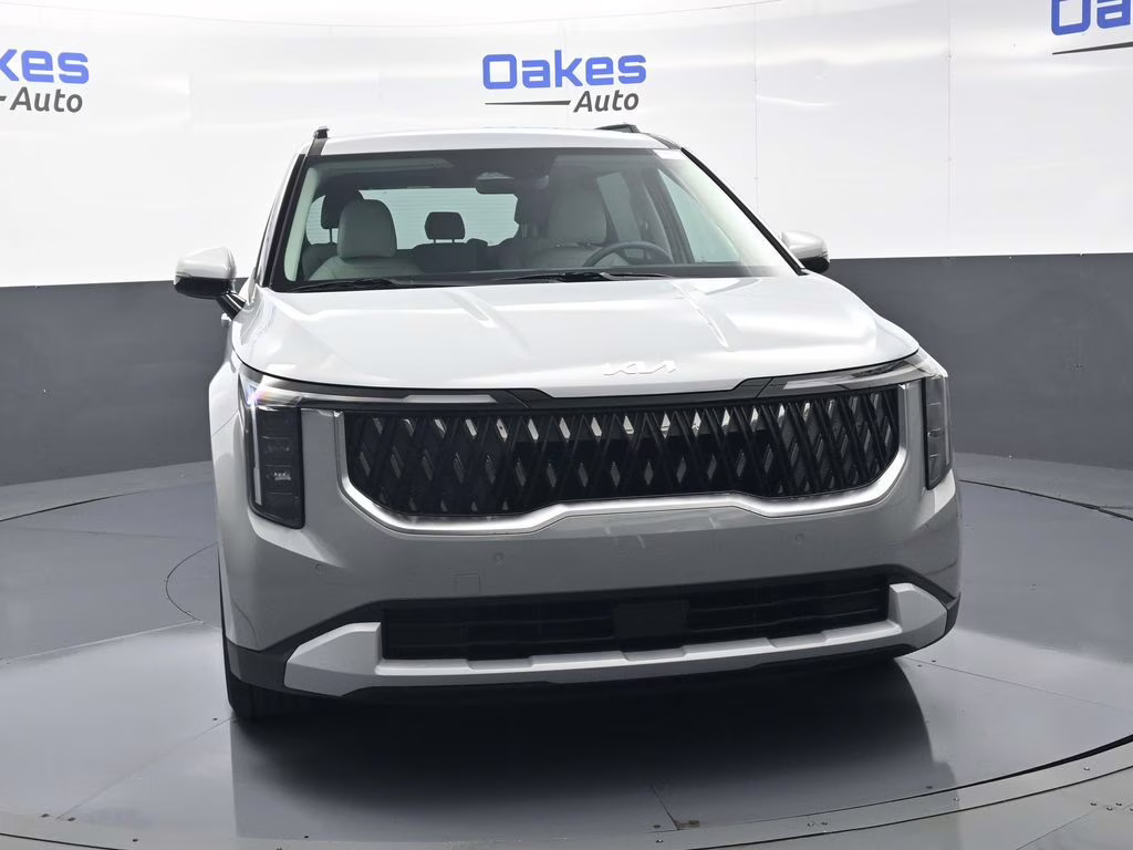 2026 Ceramic Silver Kia Carnival EX FWD Van