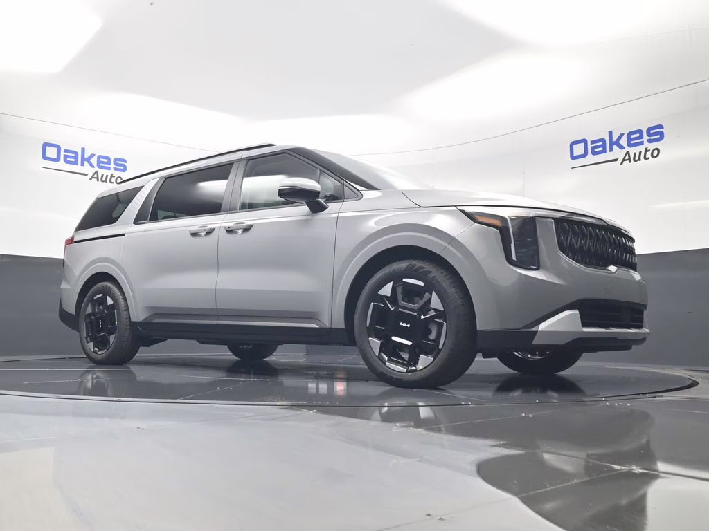 2026 Ceramic Silver Kia Carnival EX FWD Van