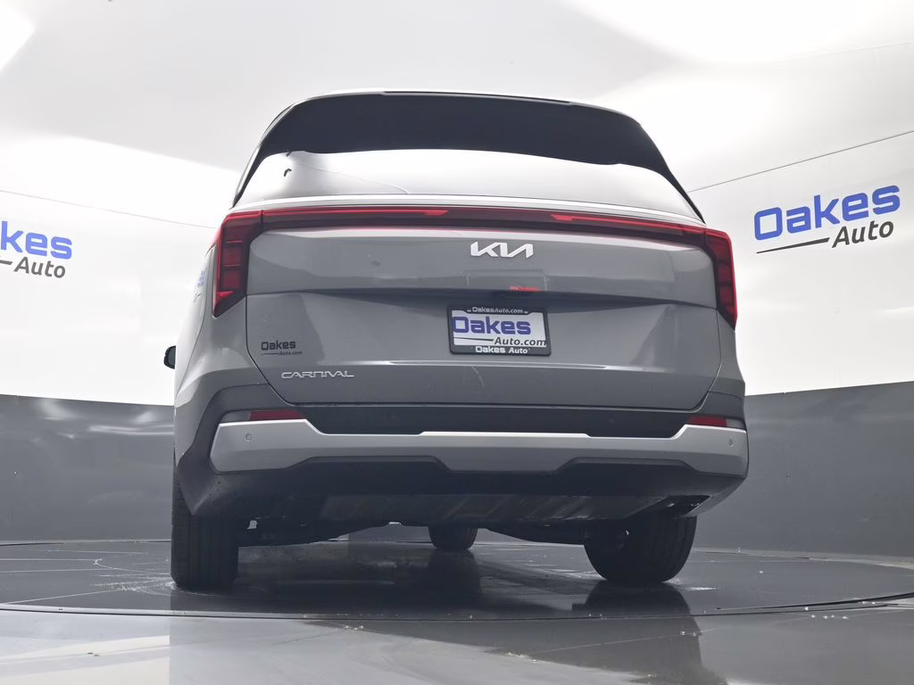 2026 Ceramic Silver Kia Carnival EX FWD Van