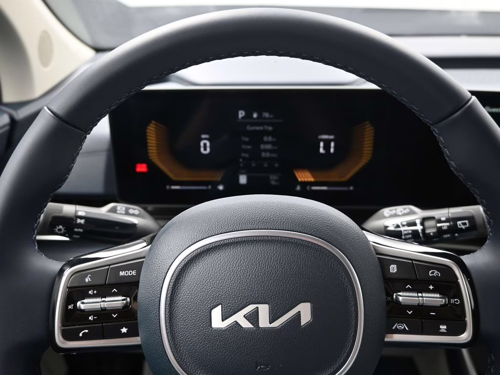 2026 Ceramic Silver Kia Carnival EX FWD Van