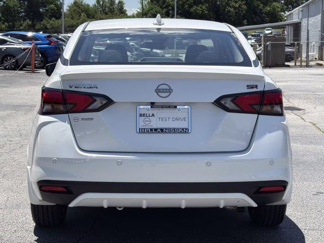 2025 Aspen White Tricoat Nissan Versa 1.6 SR FWD Sedan