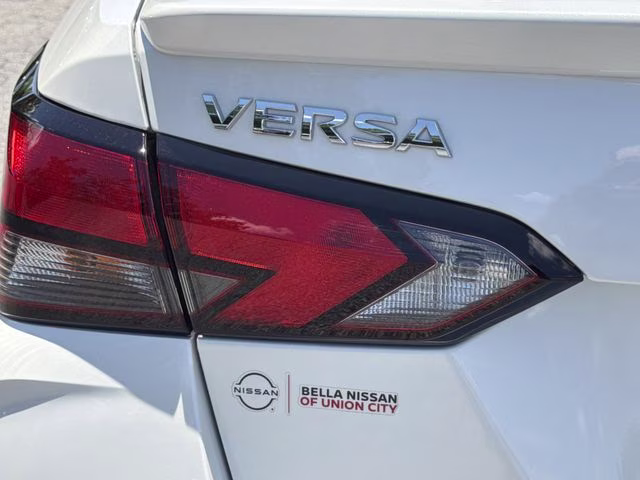 2025 Aspen White Tricoat Nissan Versa 1.6 SR FWD Sedan