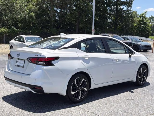 2025 Aspen White Tricoat Nissan Versa 1.6 SR FWD Sedan