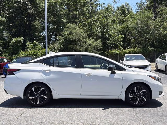 2025 Aspen White Tricoat Nissan Versa 1.6 SR FWD Sedan