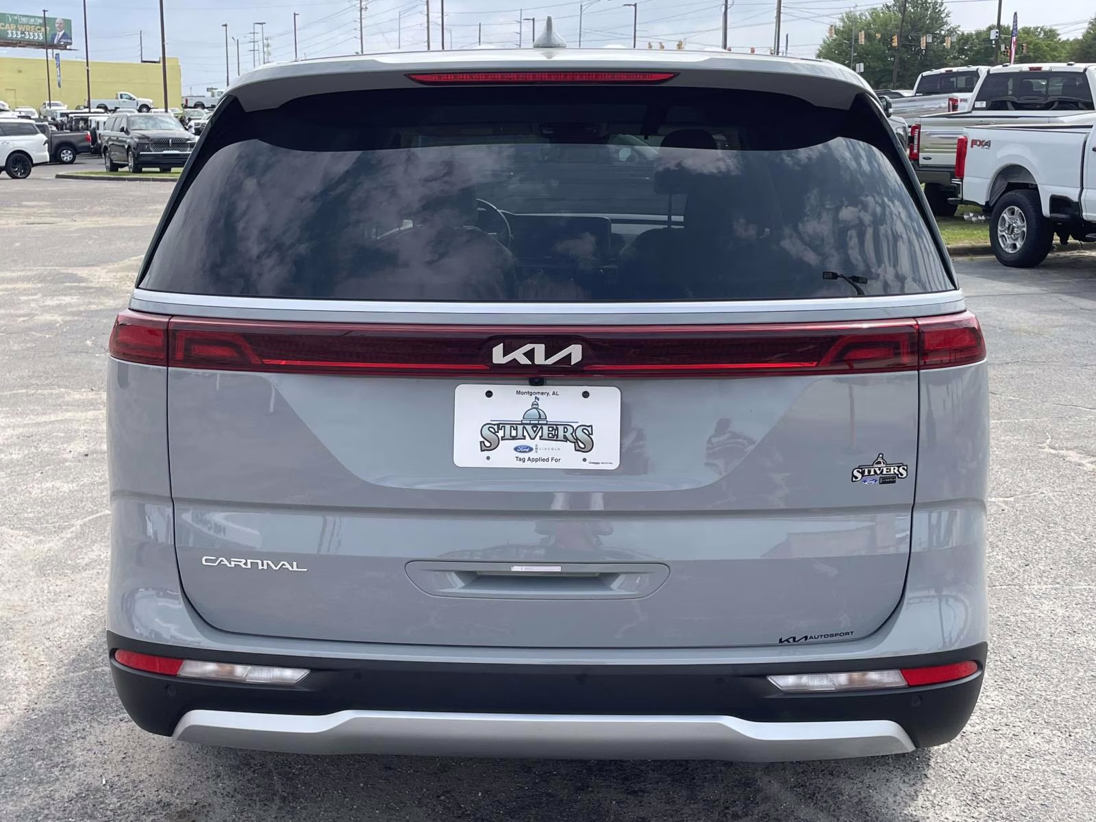 2024 Ceramic Silver Kia Carnival EX FWD Van