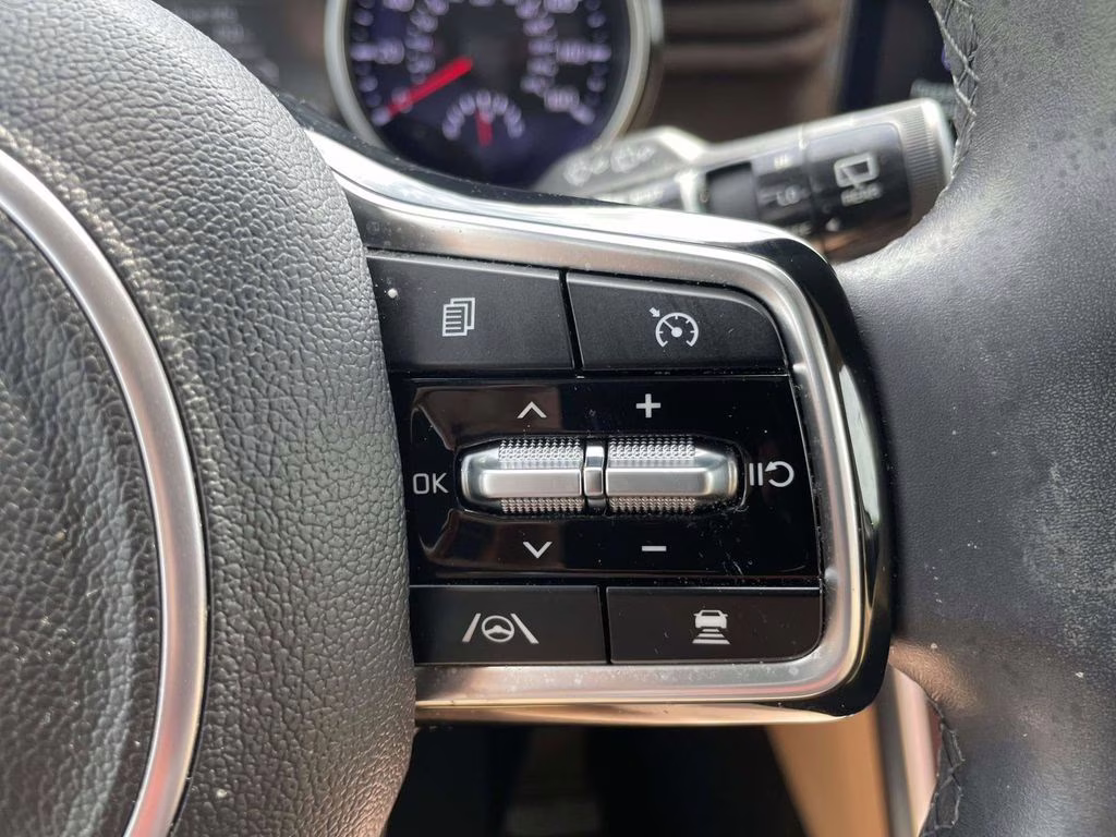 2024 Ceramic Silver Kia Carnival EX FWD Van