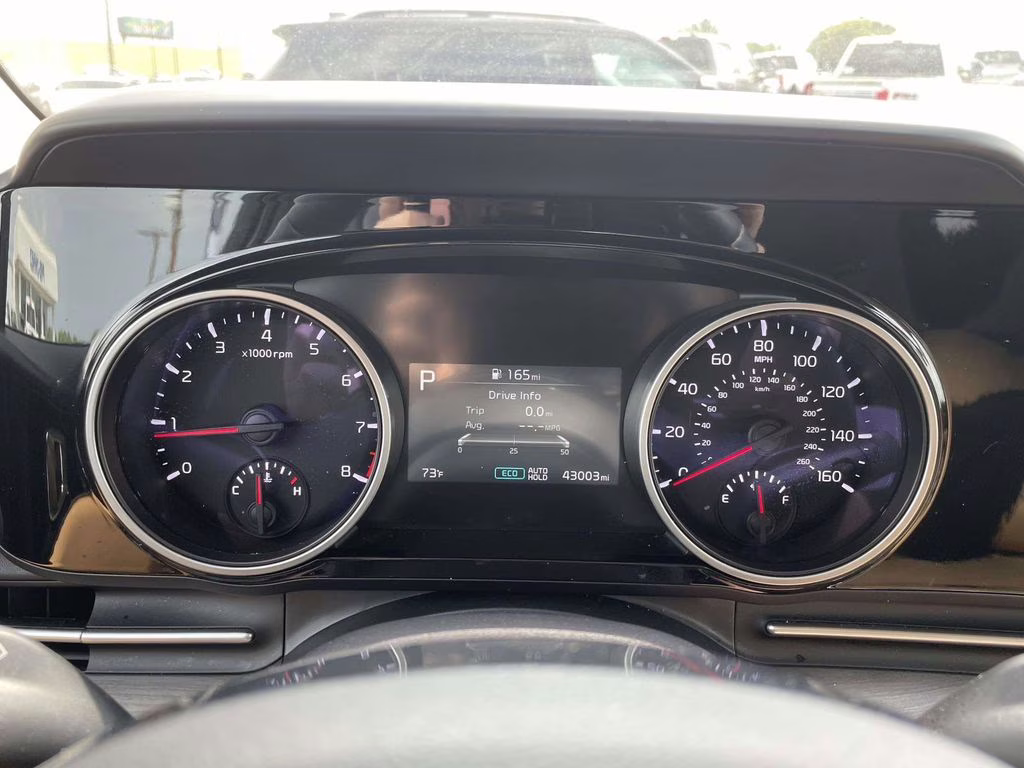 2024 Ceramic Silver Kia Carnival EX FWD Van