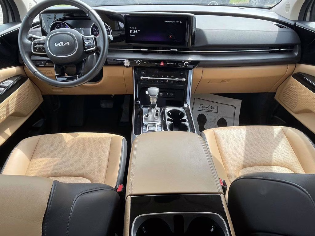 2024 Ceramic Silver Kia Carnival EX FWD Van