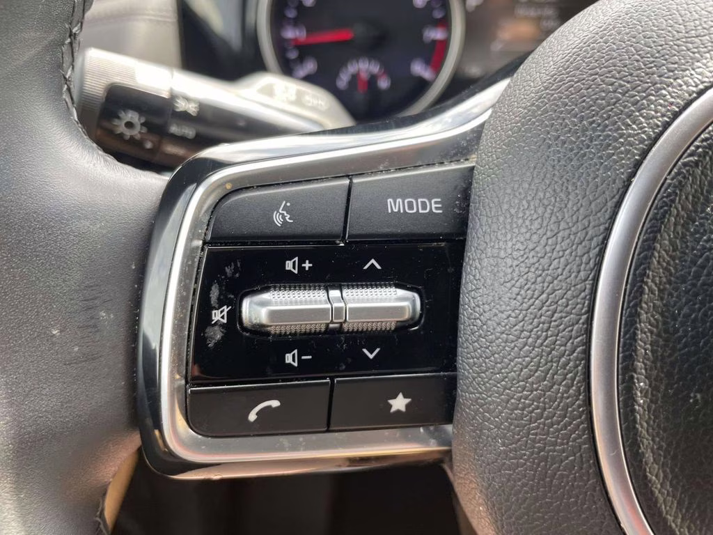 2024 Ceramic Silver Kia Carnival EX FWD Van