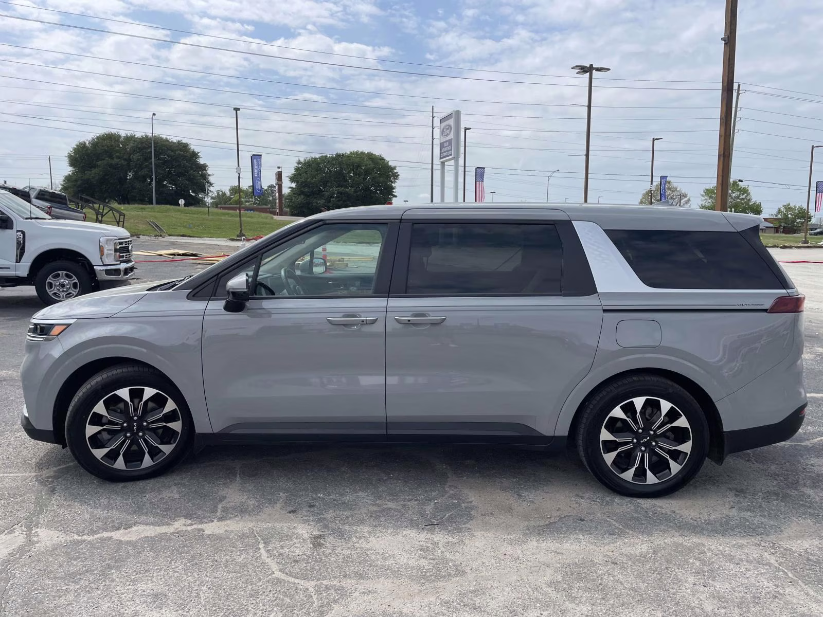 2024 Ceramic Silver Kia Carnival EX FWD Van