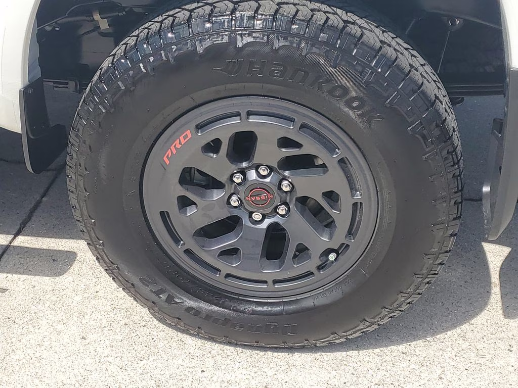 2026 Glacier White Nissan Frontier SV 4X4 Truck