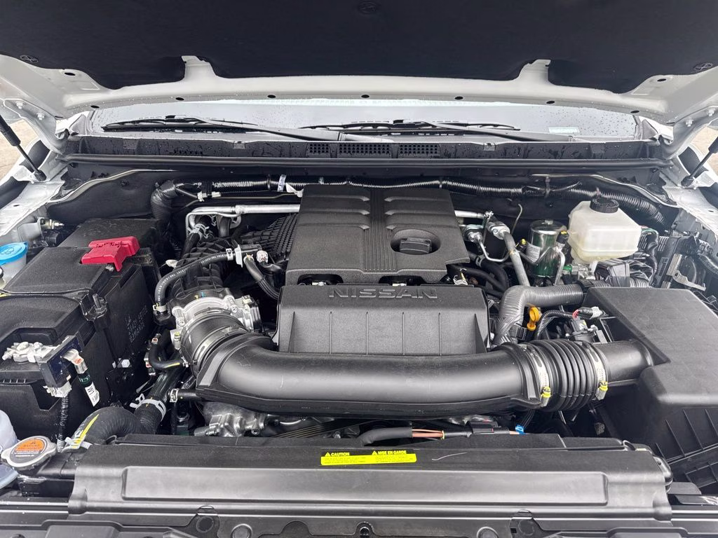 2026 Glacier White Nissan Frontier SV 4X4 Truck