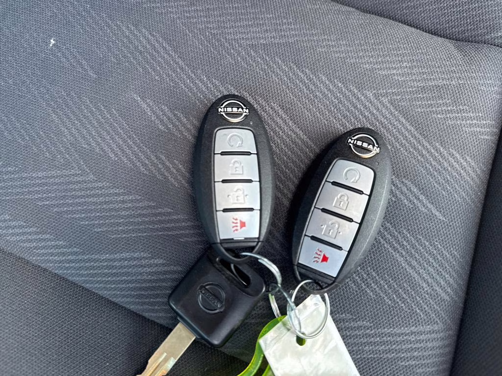 2024 Glacier White Nissan Frontier SV 4X4 Truck